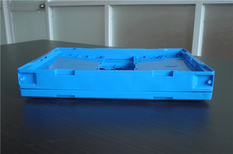 Blue collapsible plastic crate folded flat to an 85 mm height