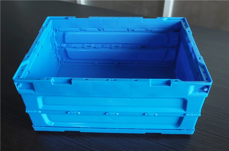 Open blue collapsible plastic storage crate showing the internal space
